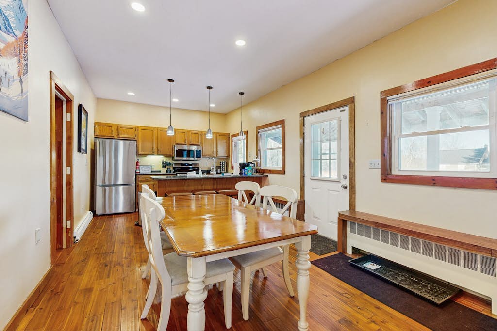 Dining table for six beside the kitchen