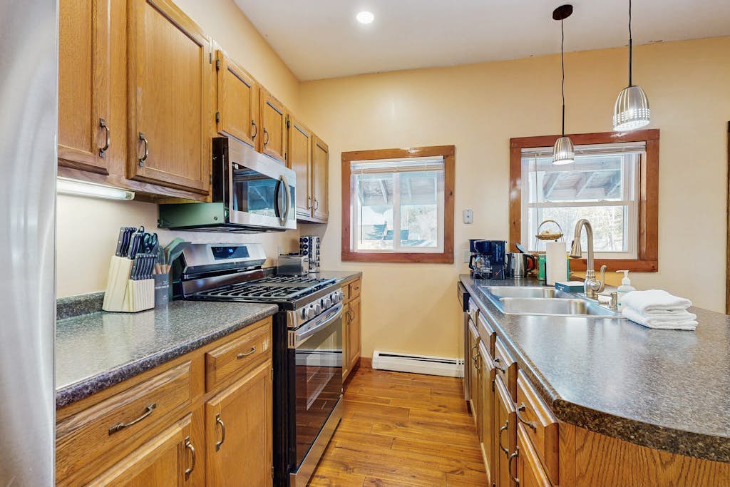 Kitchen with gas range and ample counter space