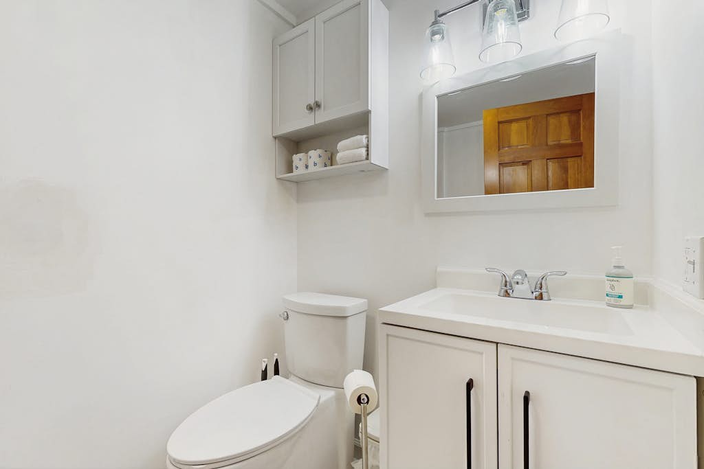 Full bathroom with vanity and mirror