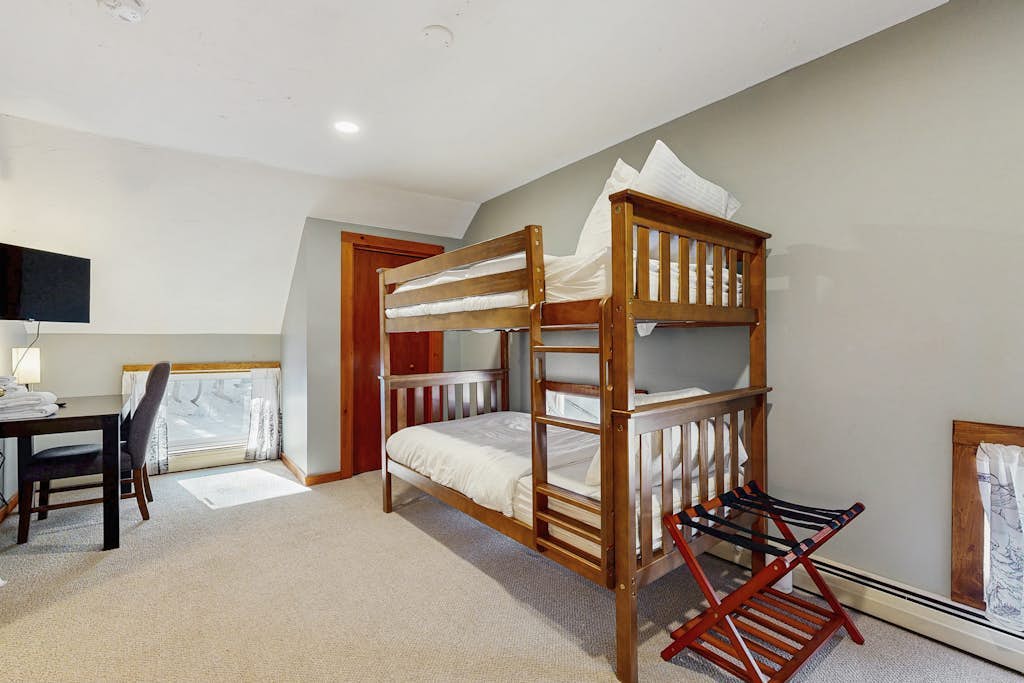 Bunk room with bunk bed and additional twin