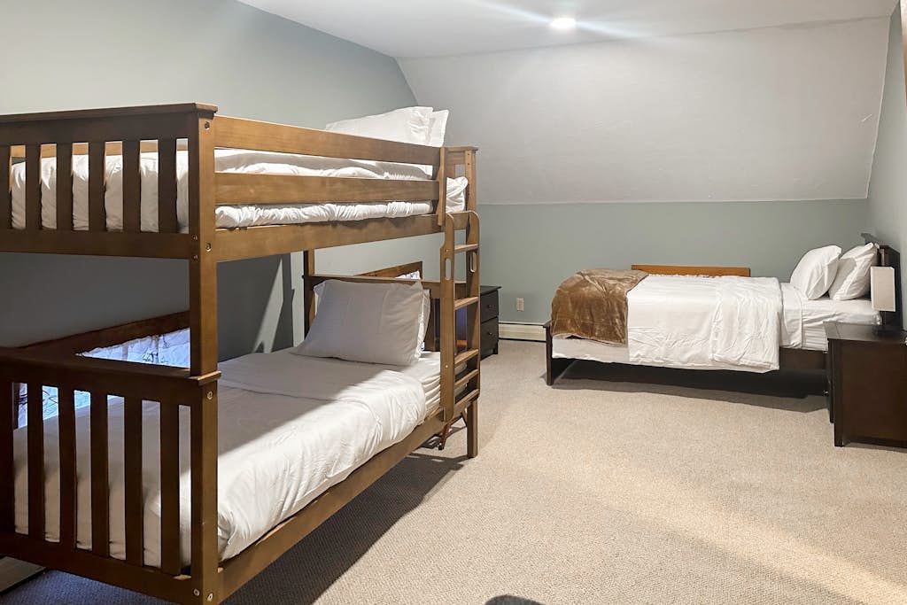 Sunlit bunk room sleeping several guests