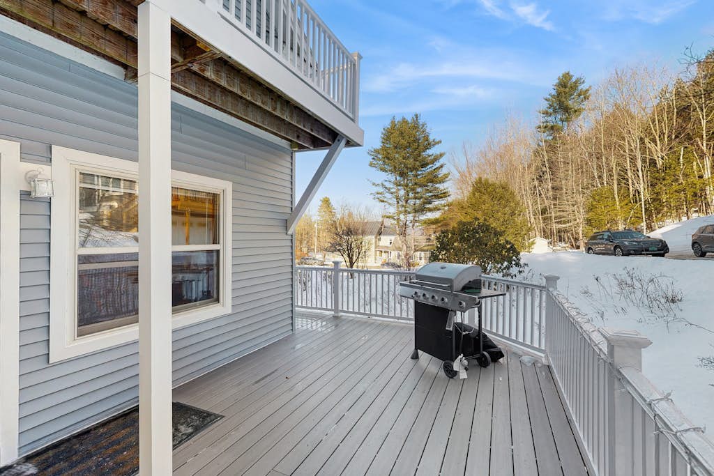 Wraparound deck with gas grill and mountain views